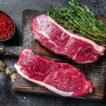 Raw,Marbled,Beef,Meat,Sirloin,Steak.,Black,Background.,Top,View