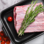 Raw,Sliced,Veal,Short,Spare,Loin,Rib,,On,White,Ceramic