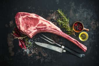 Dry,Aged,Raw,Tomahawk,Beef,Steak,With,Ingredients,For,Grilling