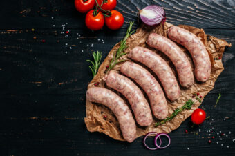 Raw,Sausages,With,Spices,And,Rosemary,On,Cutting,Board.,Cooking