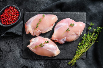 Raw,Boneless,Chicken,Thighs,Fillet.,Black,Background.,Top,View