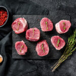 Raw,Pork,Medallion,Steaks.,Pork,Meat,Fillet.,Black,Background.,Top