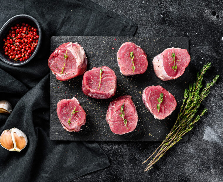 Raw,Pork,Medallion,Steaks.,Pork,Meat,Fillet.,Black,Background.,Top
