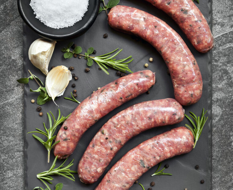 Raw,Sausages,On,Slate,,With,Herbs,And,Spices.,Overhead,View.